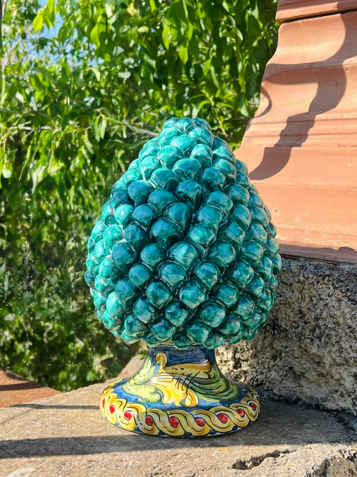 Handcrafted Sicilian ceramic pigna in emerald turquoise glaze
Mediterranean ceramic pine cone sculpture handcrafted in Sicily
Italian artisan ceramic pigna decorative object