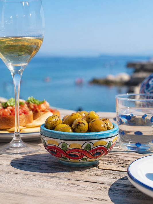 Hand-painted Sicilian ceramic olive bowl with Mediterranean motifs
Mediterranean artisan serving bowl handcrafted in Sicily
Italian ceramic aperitivo bowl filled with olives