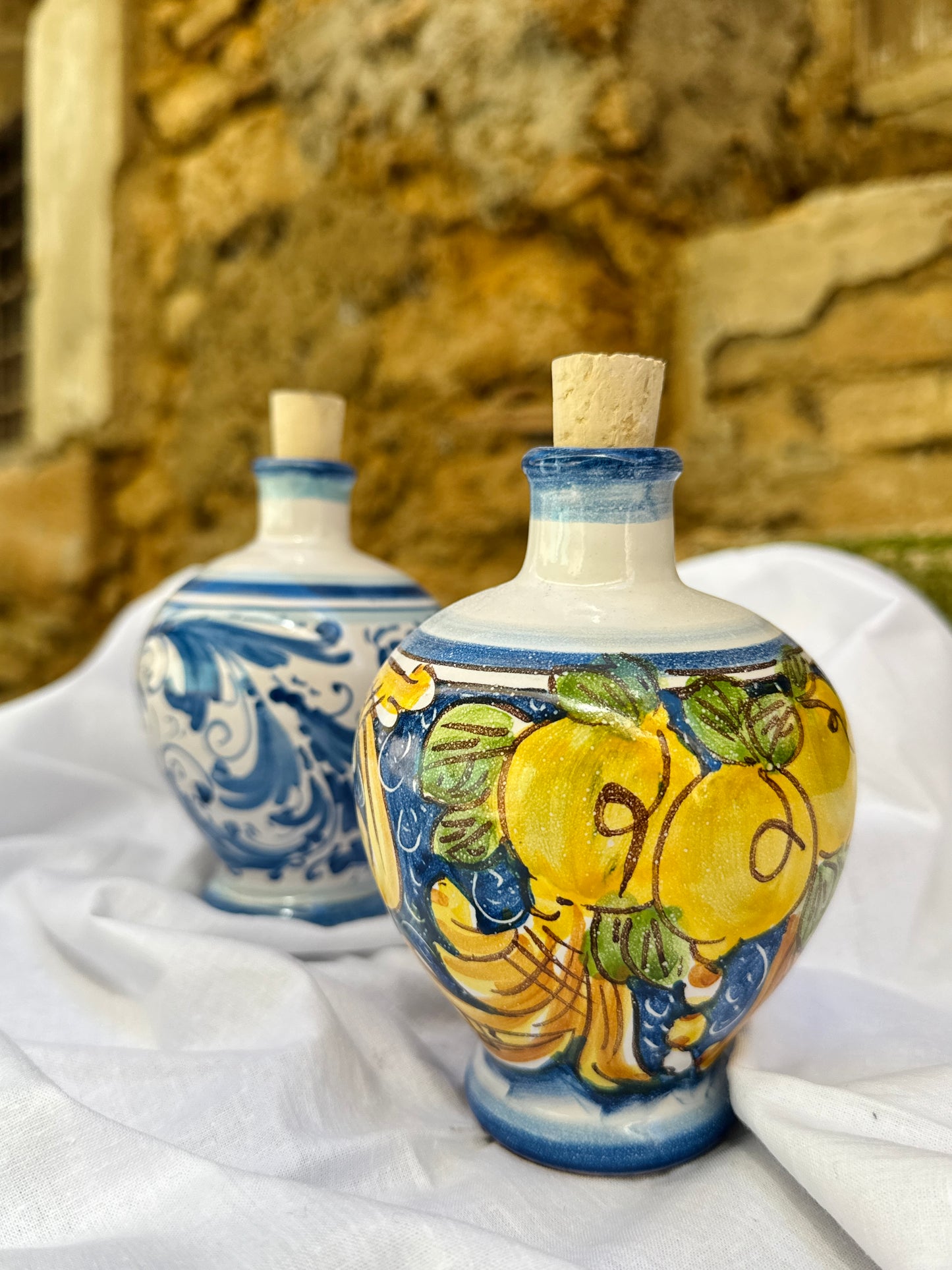 Hand-painted Sicilian ceramic oil cruets with blue and lemon motifs
Mediterranean ceramic olive oil bottles handcrafted in Sicily
Artisanal Italian ceramic cruets with traditional maiolica design