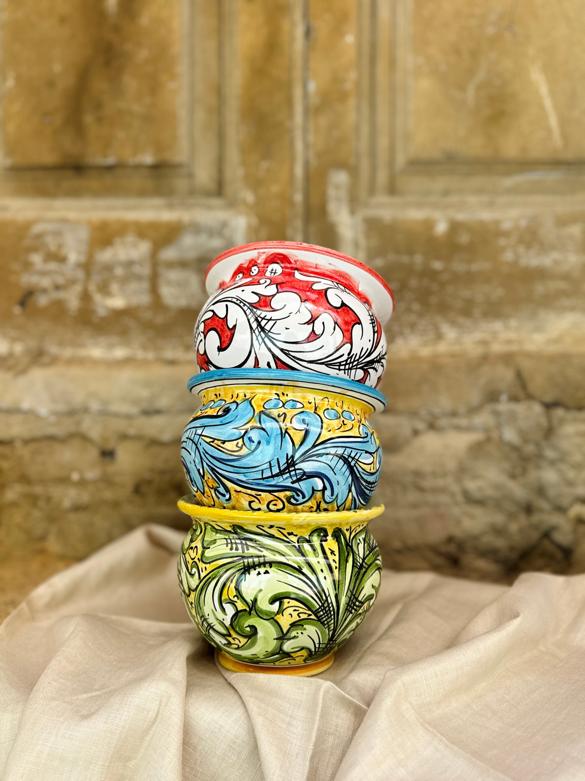 Hand-painted Sicilian ceramic cachepot in turquoise blue and yellow
Mediterranean ceramic planter handcrafted in Sicily
Italian artisan ceramic vessel with baroque motifs