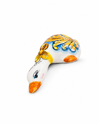 Hand-painted Sicilian ceramic duck sculpture in Mediterranean colors
Italian artisan ceramic animal decorative object
Mediterranean ceramic duck handcrafted in Sicily