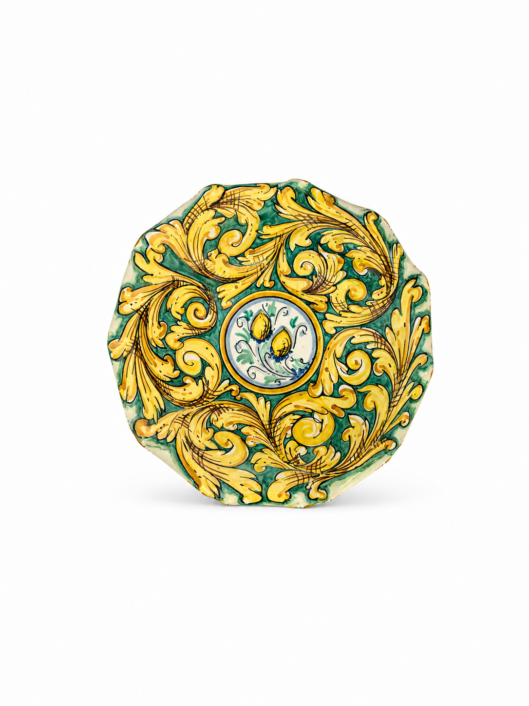 Decorative ceramic plate with gold leaf design on a white background