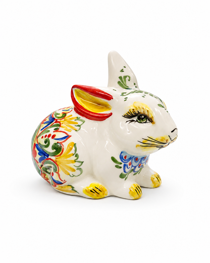 Hand-painted Sicilian ceramic rabbit sculpture with floral motifs
Italian artisan ceramic bunny decorative object
Mediterranean ceramic rabbit handcrafted in Sicily