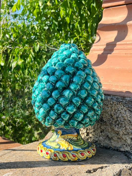 Handcrafted Sicilian ceramic pigna in emerald turquoise glaze
Mediterranean ceramic pine cone sculpture handcrafted in Sicily
Italian artisan ceramic pigna decorative object