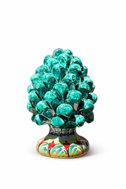 Decorative ceramic pine cone with a colorful base on a white background