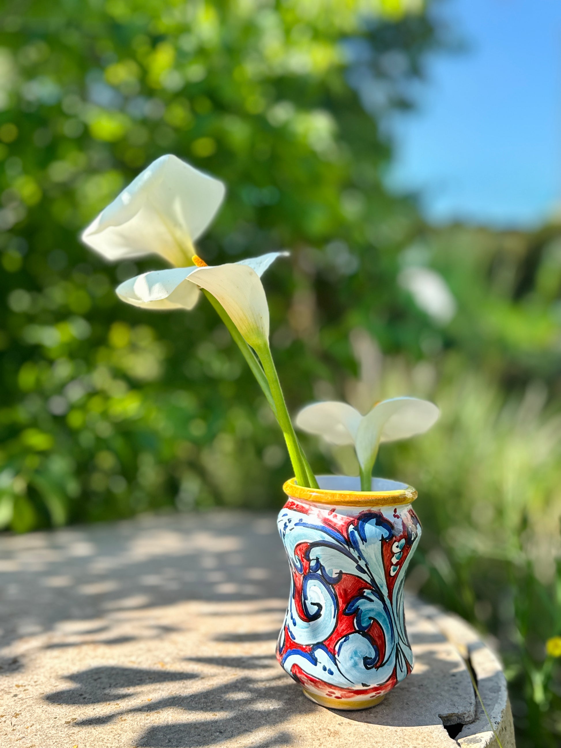 Hand-painted Sicilian ceramic vase in coral red and blue
Mediterranean artisan ceramic vase handcrafted in Sicily
Decorative Italian ceramic vase with flowing Mediterranean motifs