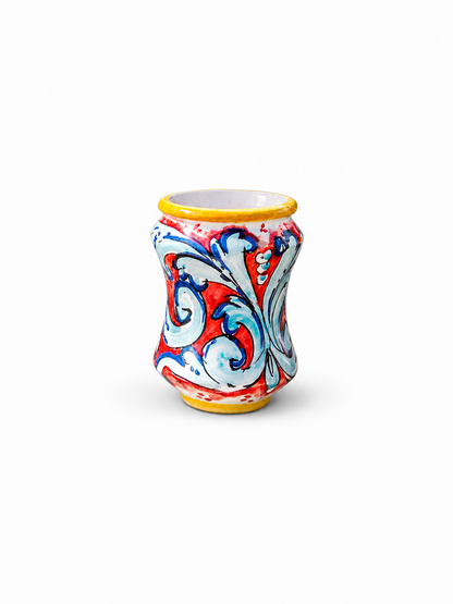 Decorative ceramic jar with colorful patterns on a white background