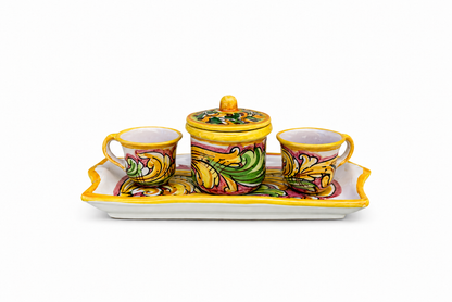 Colorful ceramic set with two cups and a lid on a white background