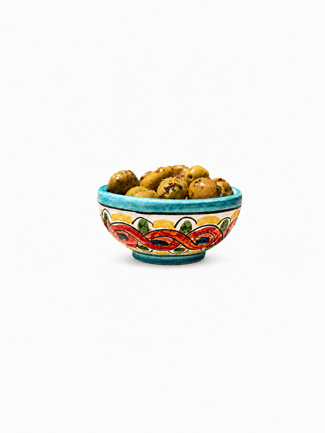 Decorative ceramic bowl with colorful patterns filled with cookies on a white background