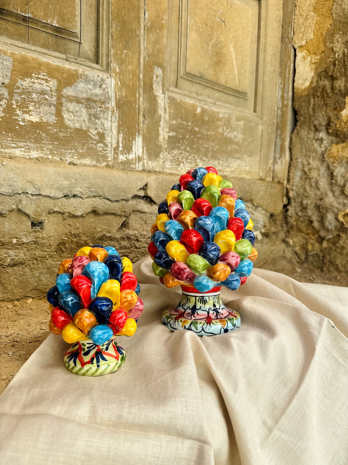 Handcrafted Sicilian ceramic pigna in emerald turquoise glaze
Mediterranean ceramic pine cone sculpture handcrafted in Sicily
Italian artisan ceramic pigna decorative object
