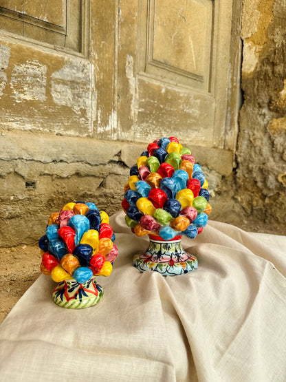 Handcrafted Sicilian ceramic pigna in emerald turquoise glaze
Mediterranean ceramic pine cone sculpture handcrafted in Sicily
Italian artisan ceramic pigna decorative object