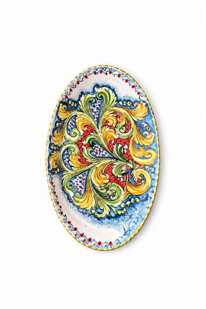 Decorative oval plate with colorful floral patterns on a white background