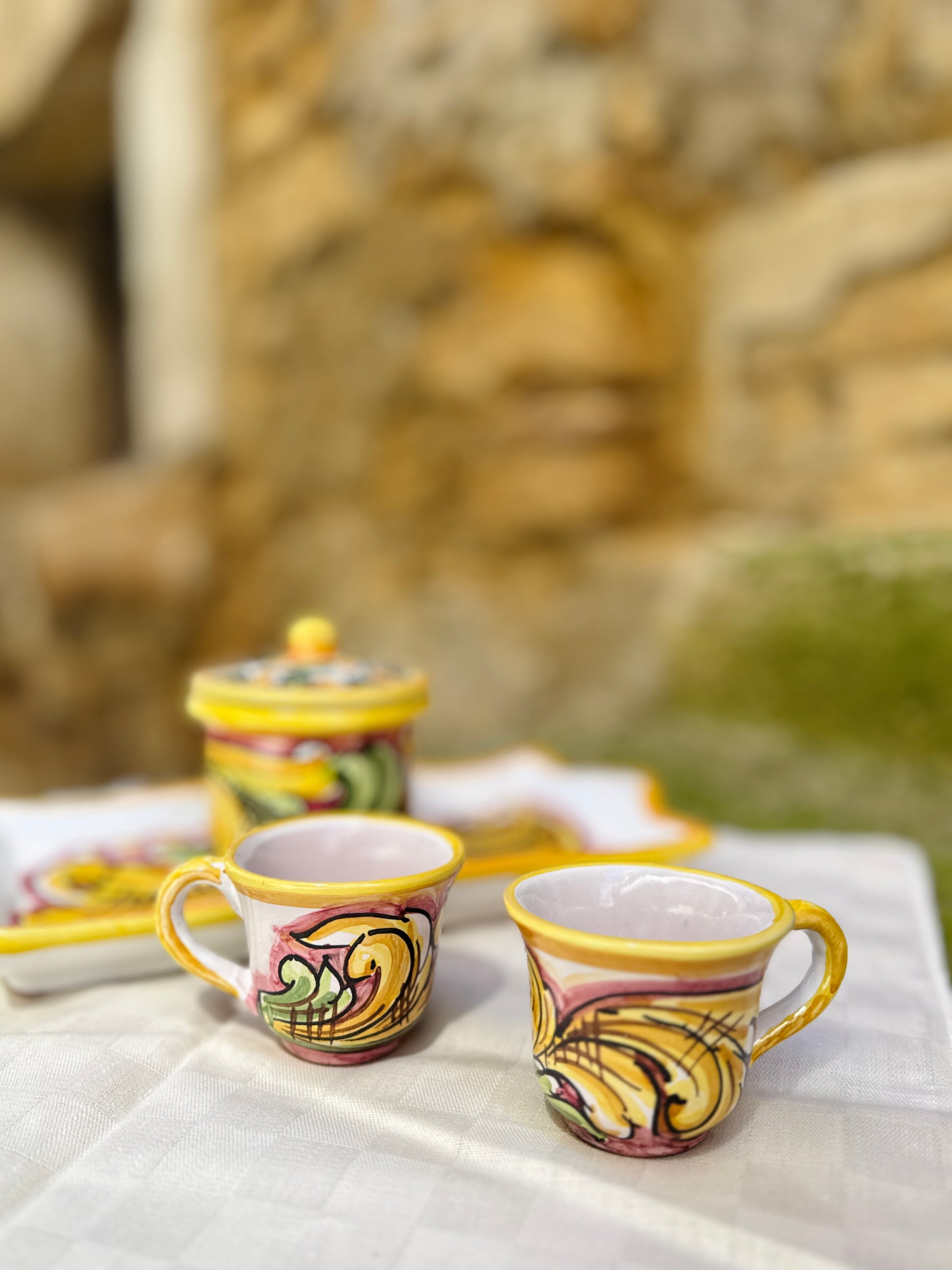 Hand-painted Sicilian ceramic espresso set with tray and sugar jar
Mediterranean ceramic coffee set handcrafted in Sicily
Italian artisan espresso cups with decorative serving tray