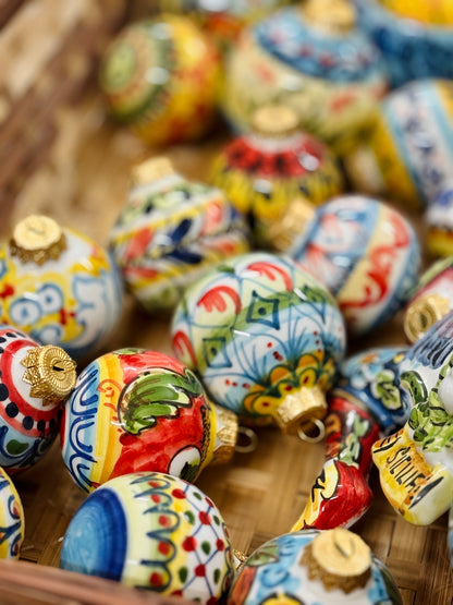 Hand-painted Sicilian ceramic ornaments with Mediterranean motifs
Italian artisan ceramic holiday decorations handcrafted in Sicily
Mediterranean ceramic baubles with colorful ornamental patterns