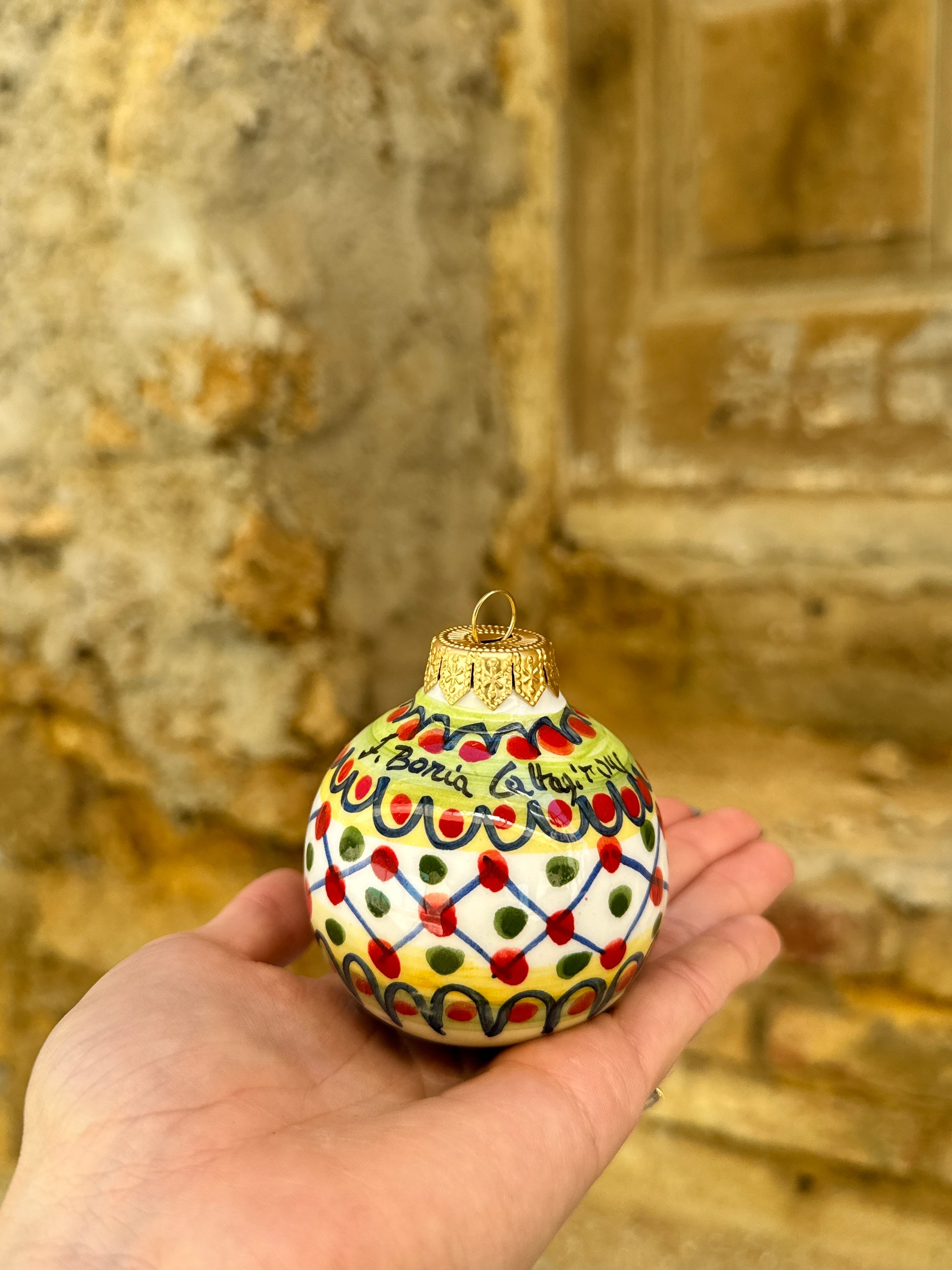 Inspired by traditional Sicilian ceramic painting and Mediterranean festive culture, these handcrafted ornaments transform classic holiday decoration into collectible artisan objects full of personality and color.