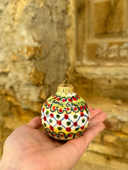 Inspired by traditional Sicilian ceramic painting and Mediterranean festive culture, these handcrafted ornaments transform classic holiday decoration into collectible artisan objects full of personality and color.