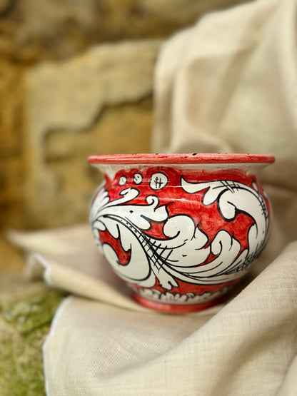 Hand-painted Sicilian ceramic cachepot in turquoise blue and yellow
Mediterranean ceramic planter handcrafted in Sicily
Italian artisan ceramic vessel with baroque motifs