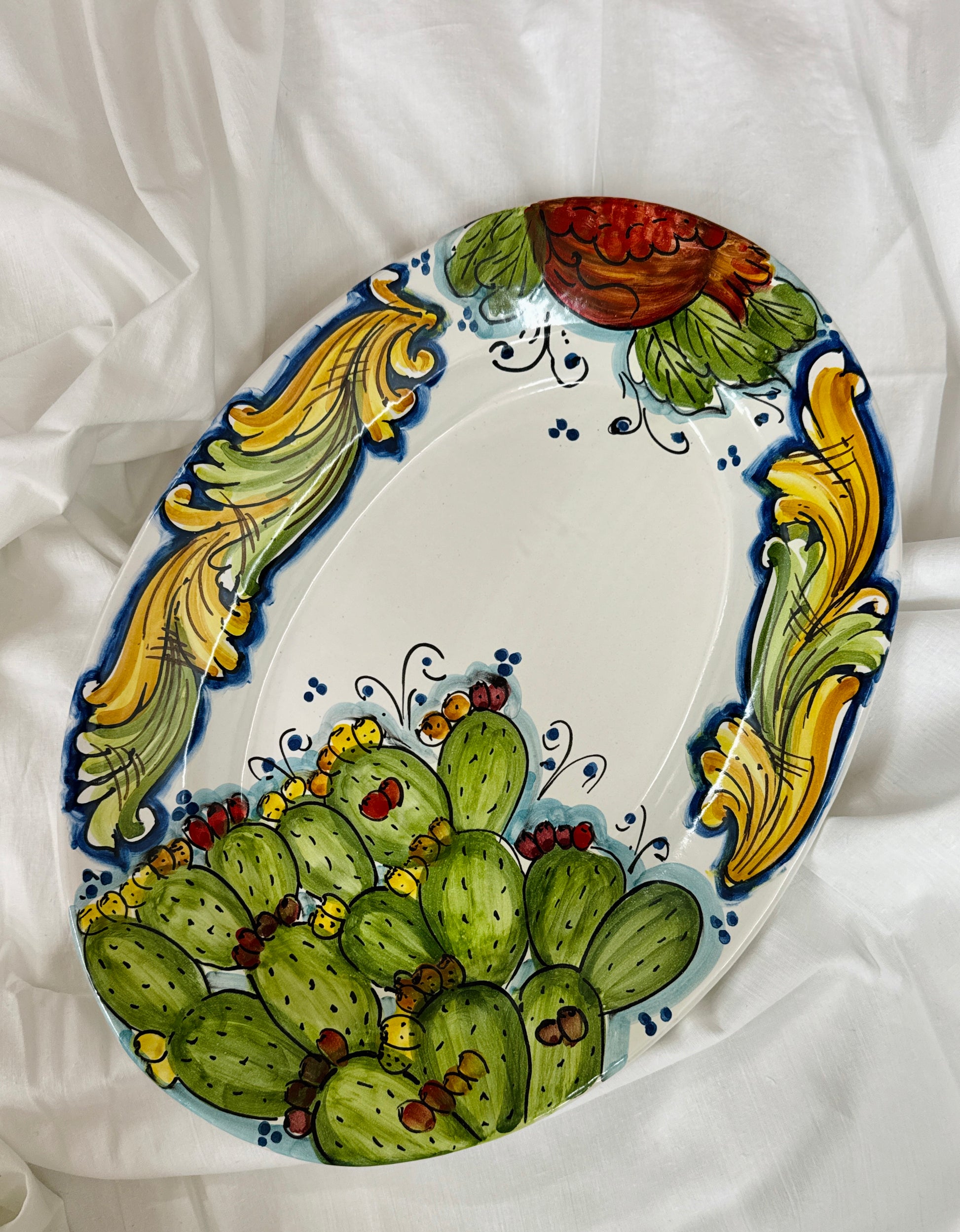 Hand-painted Sicilian ceramic platter with prickly pear motif
Mediterranean serving platter handcrafted in Sicily
Italian ceramic oval platter inspired by Sicilian fichi d’India