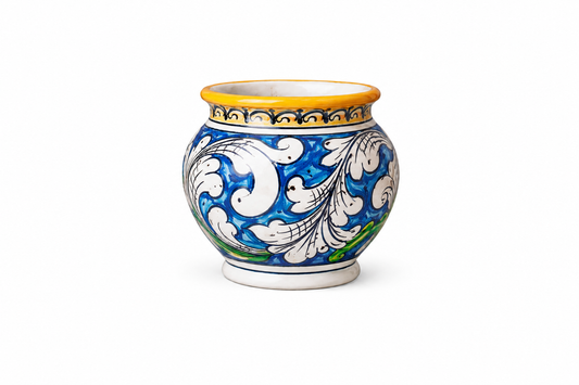 Hand-painted Sicilian ceramic cachepot in cobalt blue and white
Mediterranean ceramic planter handcrafted in Sicily
Italian artisan ceramic vessel with baroque motifs