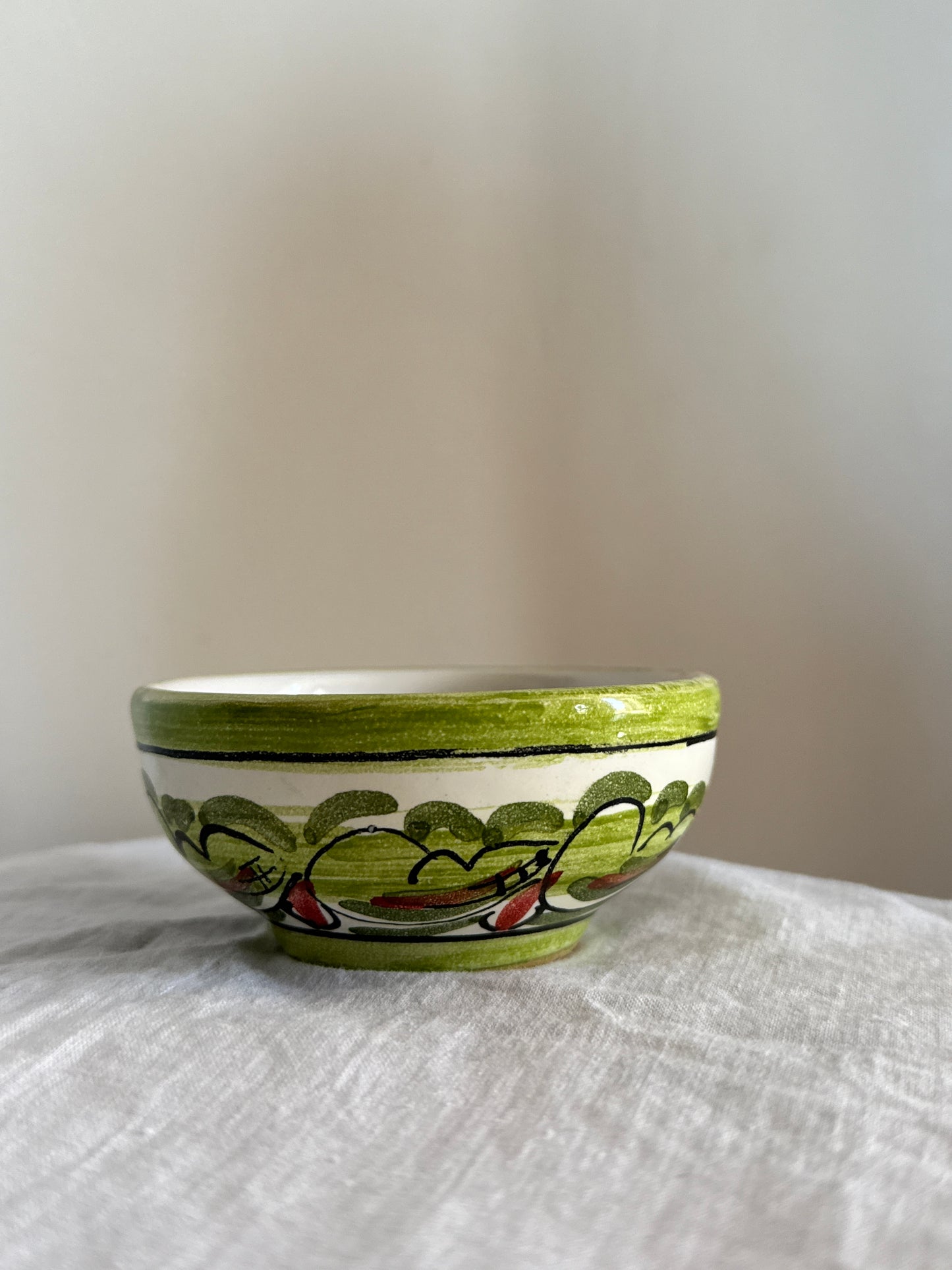 Hand-painted in Sicily, this ceramic bowl combines traditional Mediterranean patterns with timeless artisanal craftsmanship.