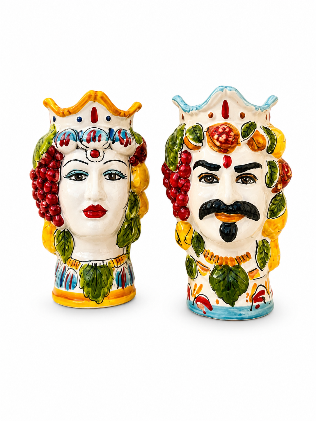 Pair of handcrafted Sicilian Moor head ceramic vases with colorful fruit crown decoration, inspired by traditional Caltagirone majolica craftsmanship.