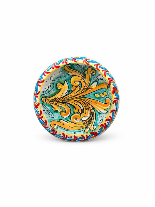 Handcrafted Sicilian ceramic decorative bowl featuring traditional baroque majolica motifs in turquoise, gold, red and blue tones.