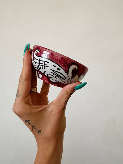 Hand-painted Sicilian ceramic condiment bowl with traditional burgundy and white majolica pattern, crafted by artisans in Caltagirone.