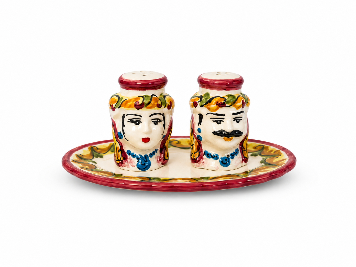 Handcrafted Sicilian ceramic salt and pepper set featuring traditional Moor heads on a matching tray.