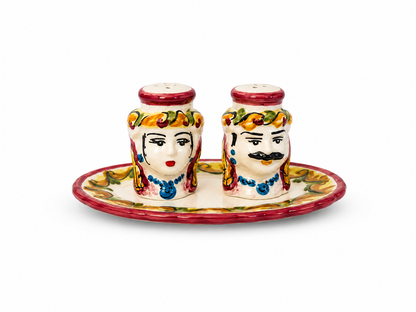 Handcrafted Sicilian ceramic salt and pepper set featuring traditional Moor heads on a matching tray.
