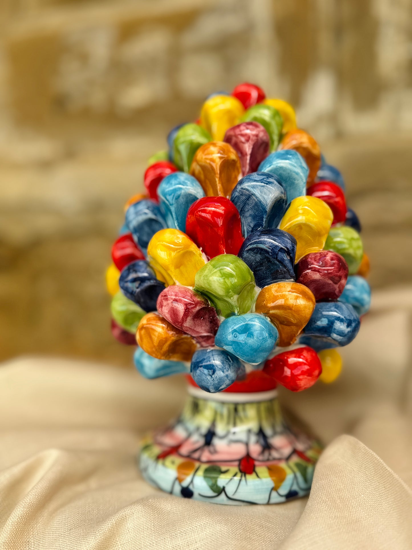 Colorful candy bouquet on a decorative stand with a blurred background