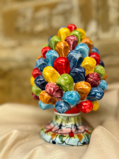 Colorful candy bouquet on a decorative stand with a blurred background